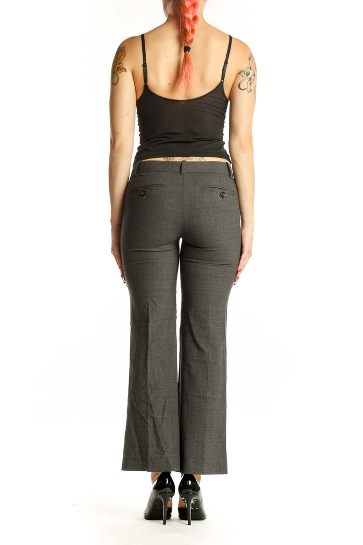 Back view of gray Theory dress pants showing tailored silhouette and length on model