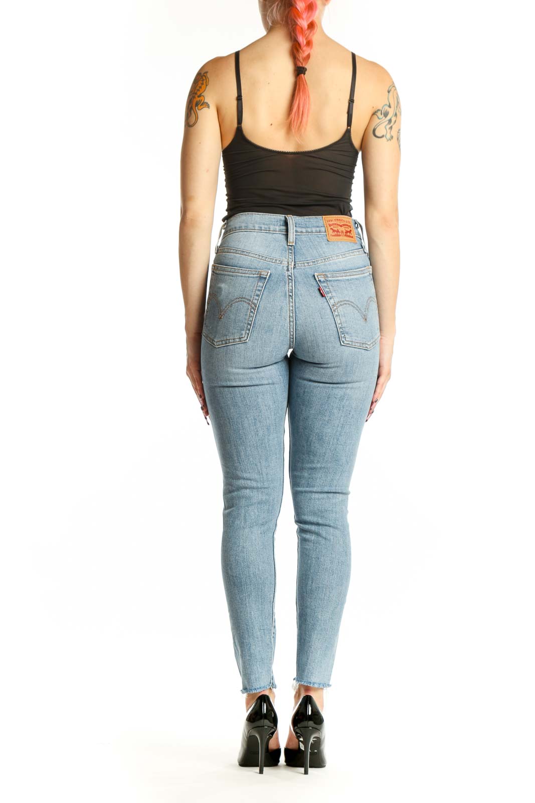 Light blue Levi's distressed skinny jeans back view, showing classic five-pocket styling and ripped details