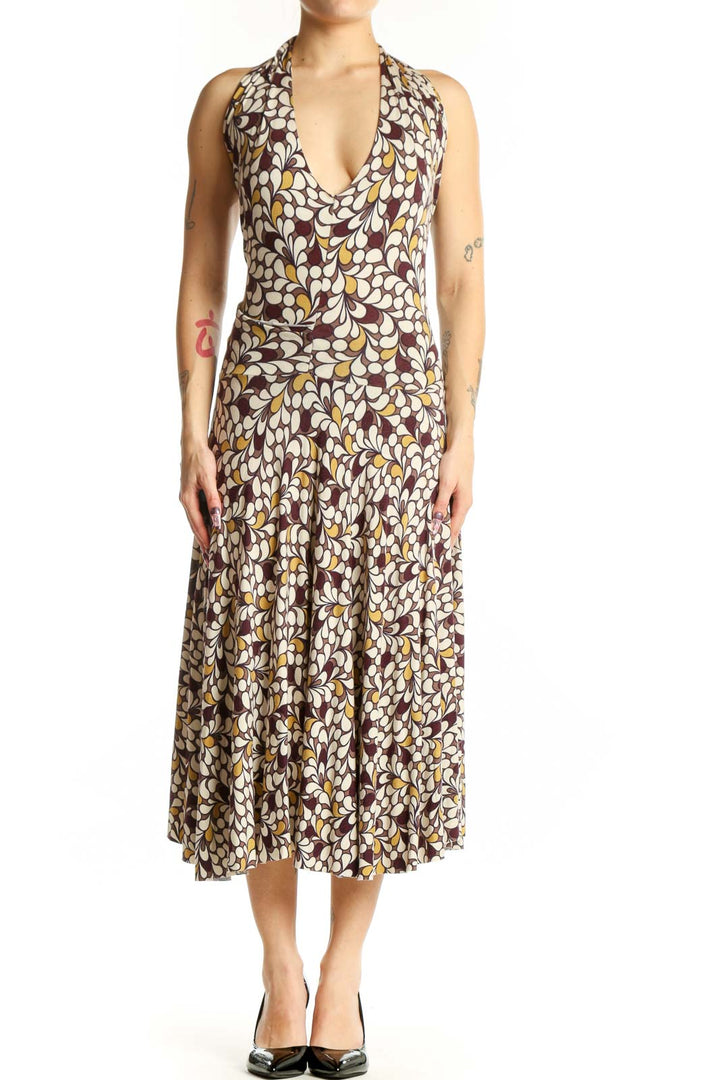 Brown floral halter midi dress with multicolor botanical print and draped cowl neckline, front view