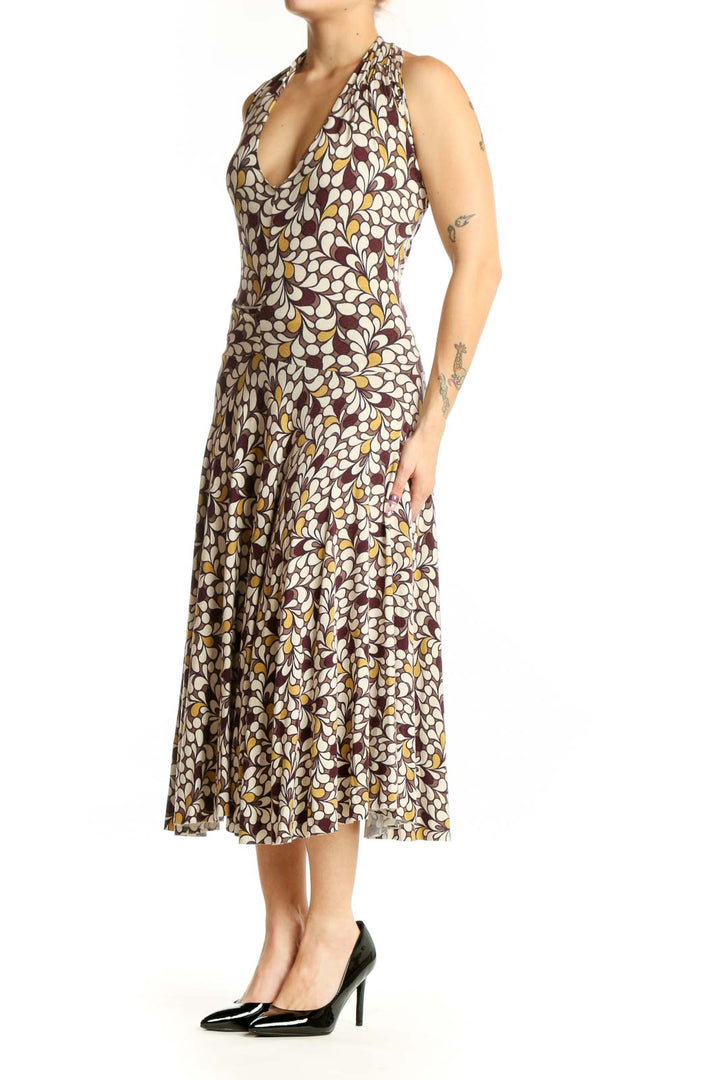 Brown floral halter midi dress with multicolor botanical print and draped cowl neckline, front view