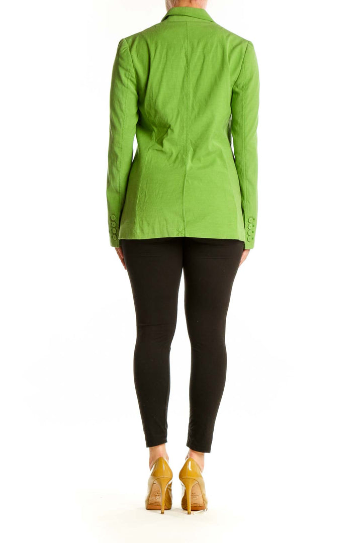 Back view of lime green tailored blazer showing structured silhouette and button-front closure