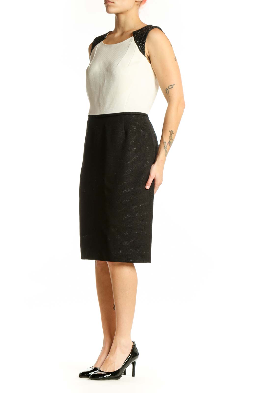 Black and cream Tahari color block sheath dress with sparkly black shoulder panels, front view