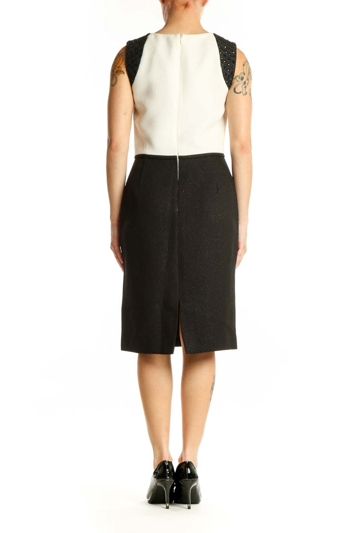 Black and cream Tahari color block sheath dress with sparkly black shoulder panels, back view