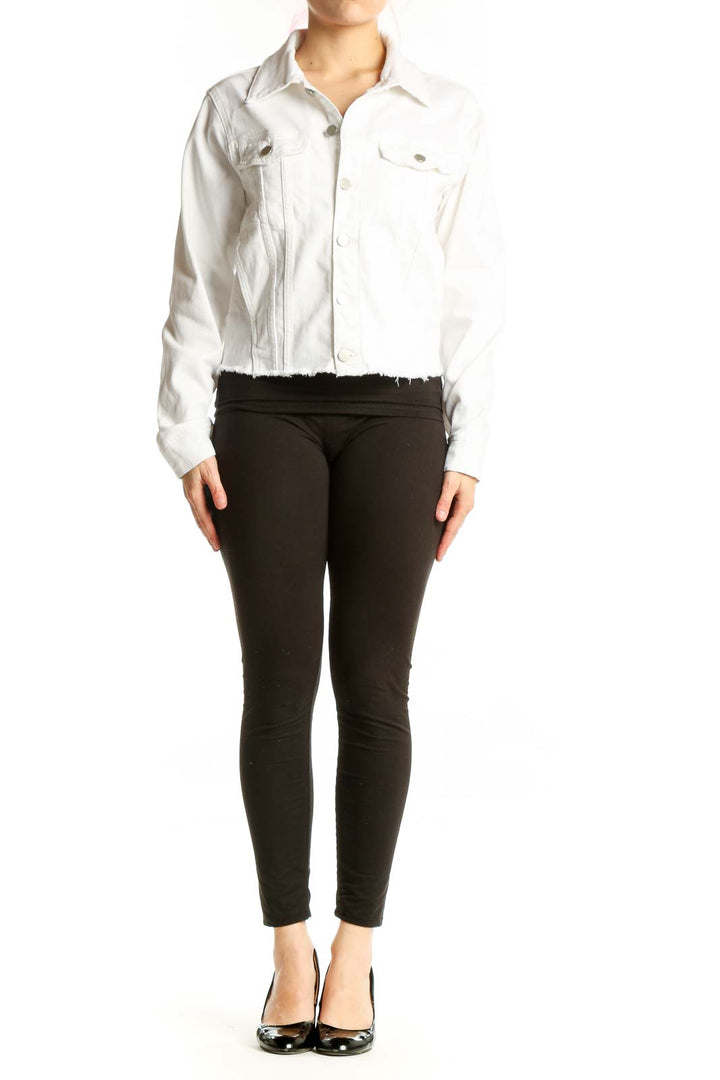 White cropped denim jacket by DL1961 with button-front closure and dual chest pockets, worn with black pants