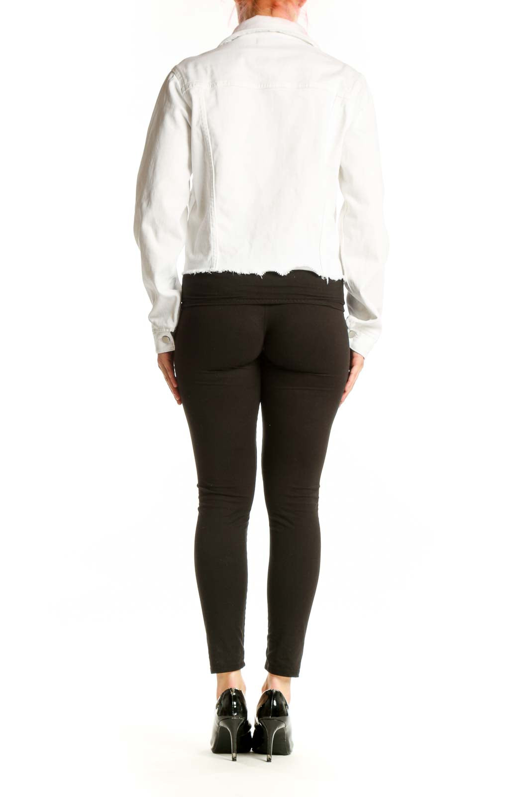 Back view of white cropped denim jacket showing frayed hem detail and classic denim construction