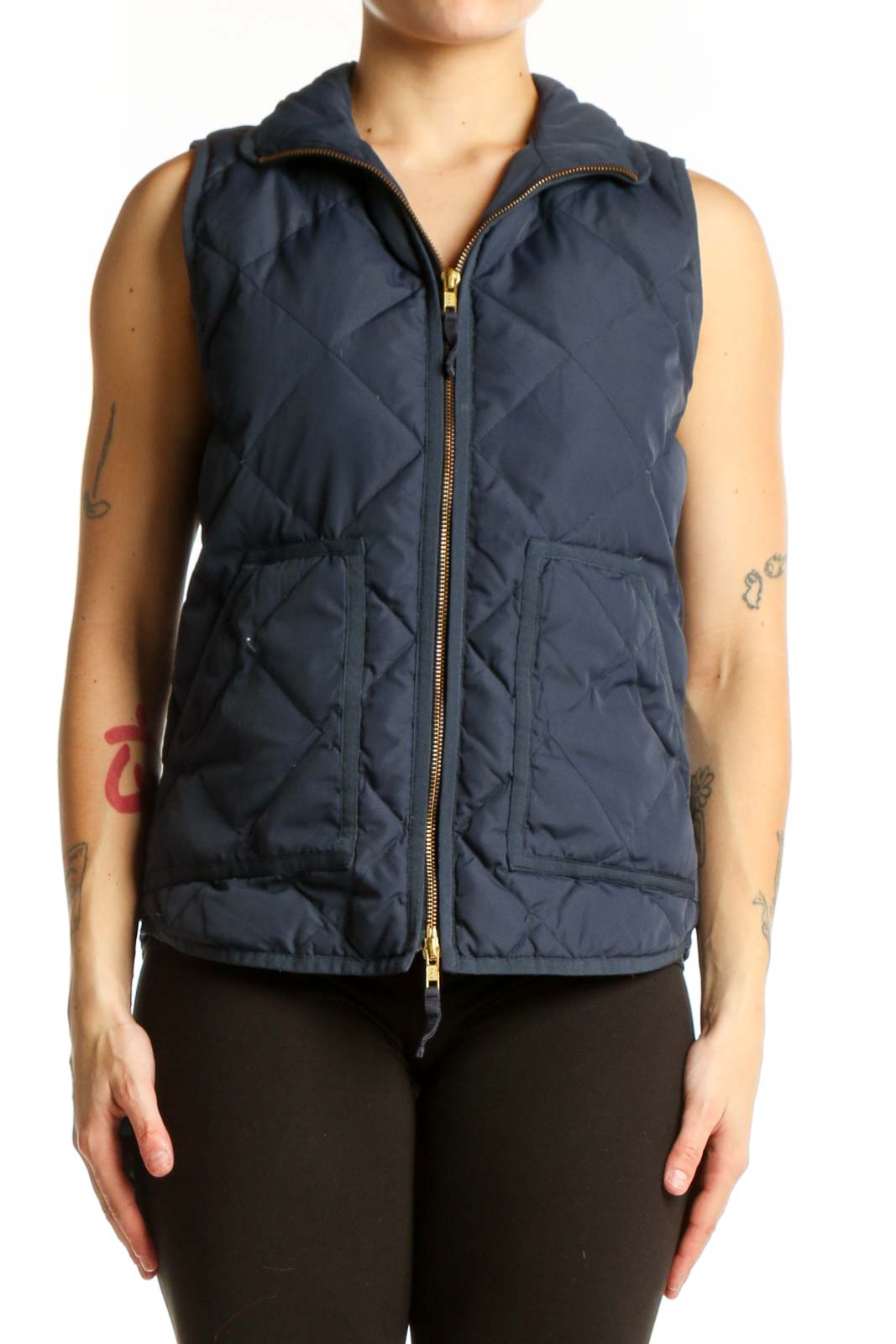 Navy quilted puffer vest with diamond quilted pattern and gold-tone zipper closure, front view