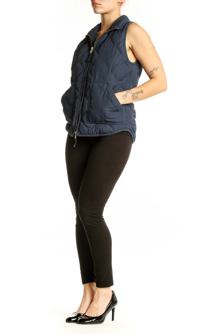 Navy quilted puffer vest with diamond quilted pattern and gold-tone zipper closure, front view