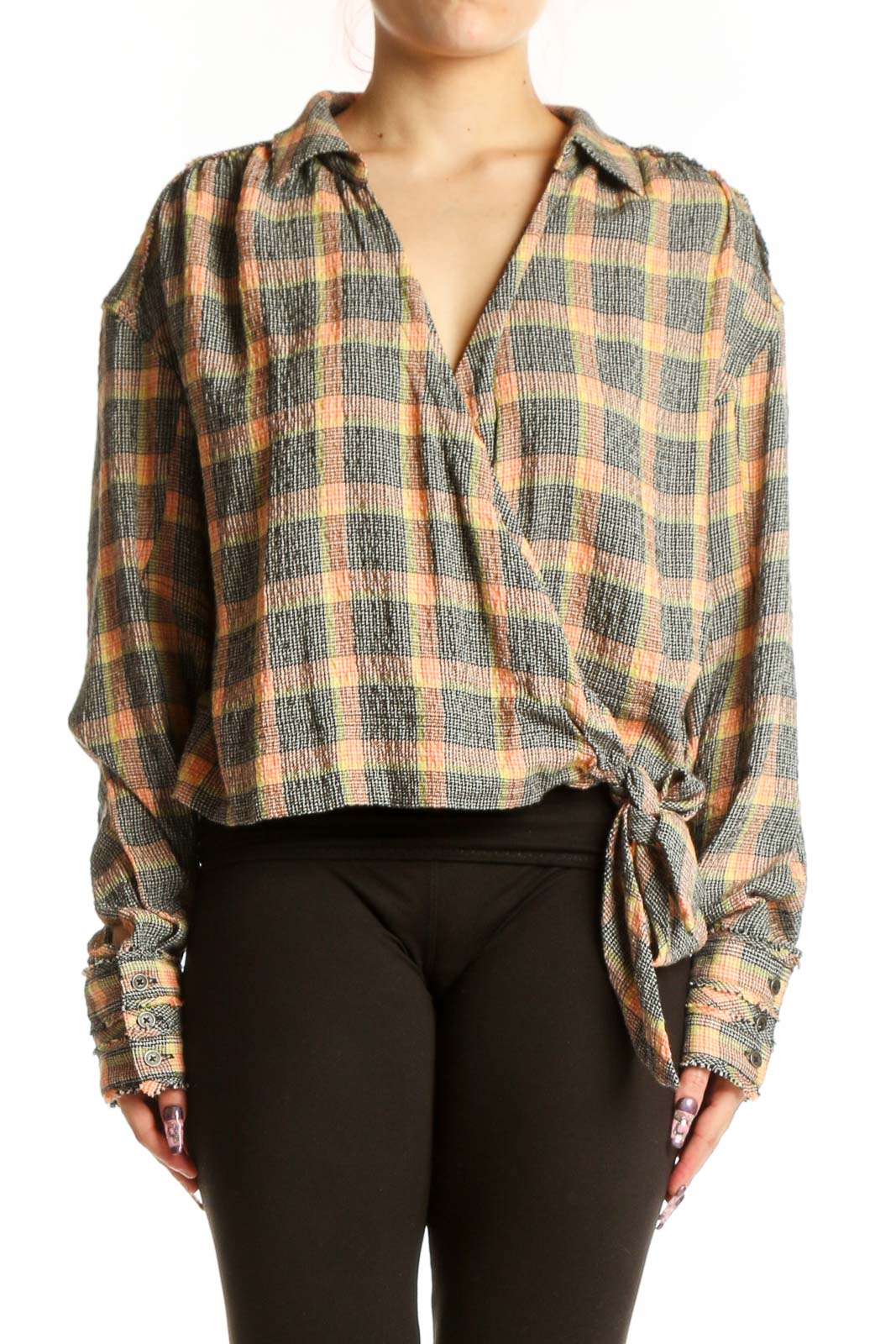Multicolor plaid tie-front button-up shirt with long sleeves and tie-front detail at hem, worn with black leggings
