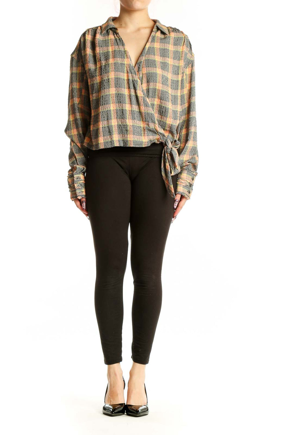 Multicolor plaid tie-front button-up shirt with long sleeves and tie-front detail at hem, worn with black leggings