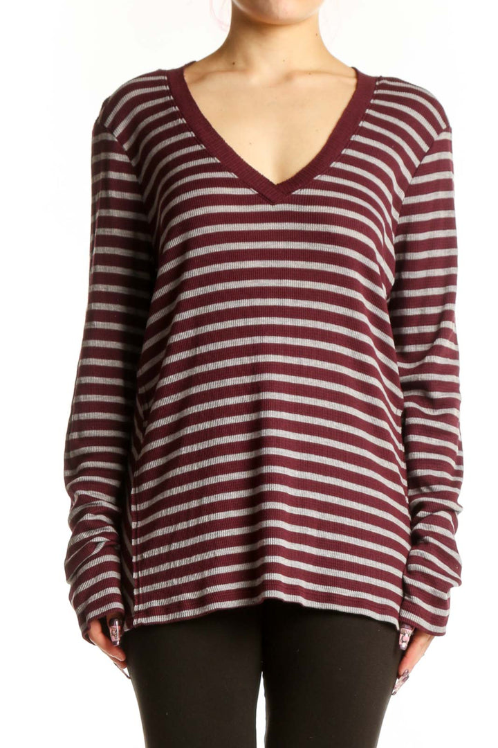 Burgundy and cream striped V-neck long sleeve top by Michael Stars, front view on model