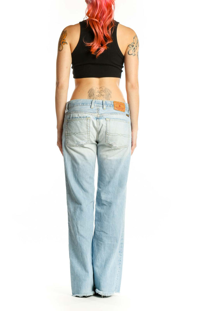 Back view of light blue Lucky Brand wide-leg denim jeans showing the classic pocket design and relaxed fit through hips and thighs