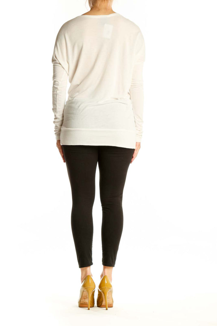 Back view of cream M Missoni viscose top showing relaxed fit and tassel detail placement