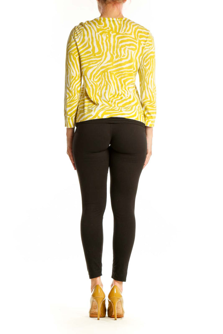 Back view of yellow zebra print cardigan showing geometric stripe pattern and relaxed fit silhouette