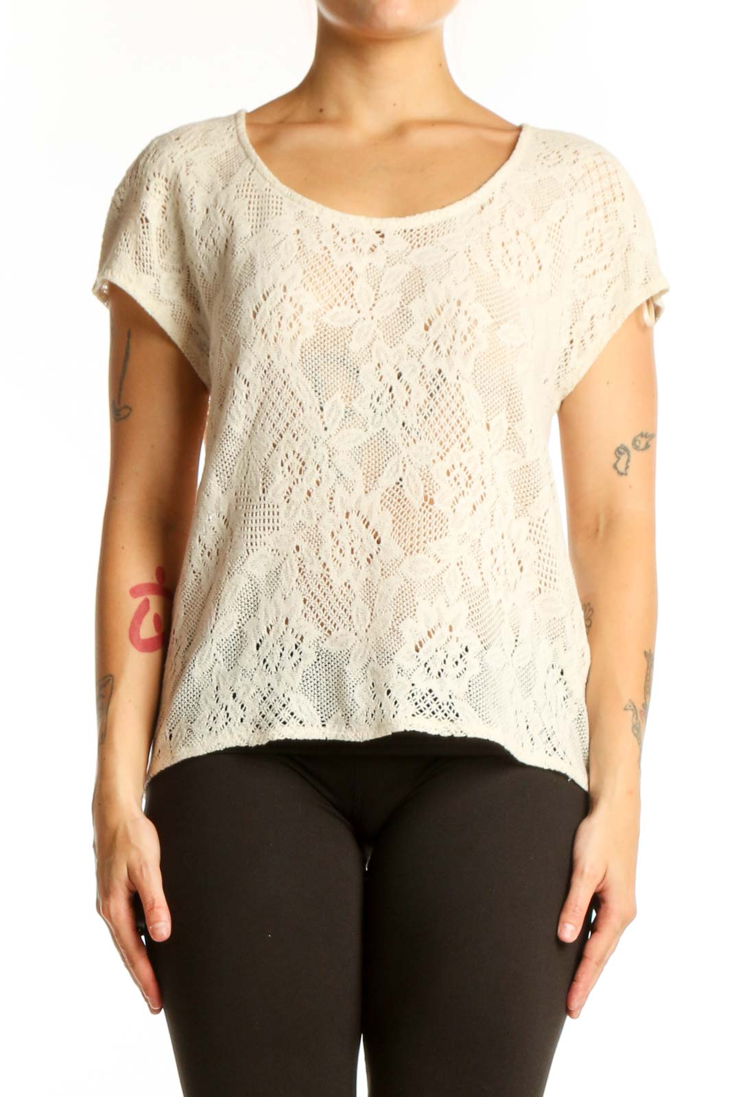 Cream lace short sleeve top with all-over lace pattern and rounded neckline, front view