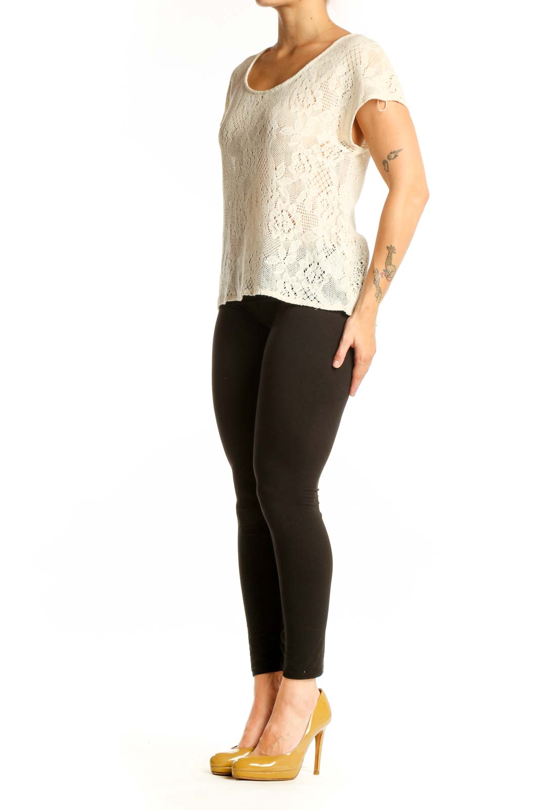 Cream lace short sleeve top with all-over lace pattern and rounded neckline, front view