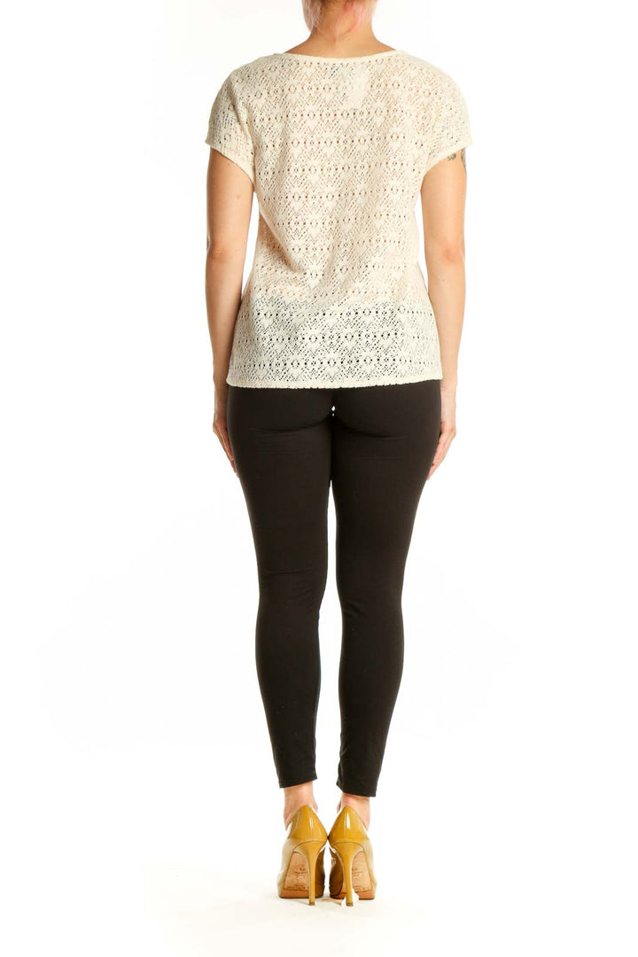 Cream lace short sleeve top back view showing lace detailing and relaxed fit