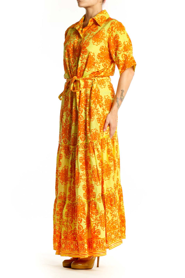 Yellow and orange floral cotton maxi dress with button-front, collar, and tiered skirt - front view