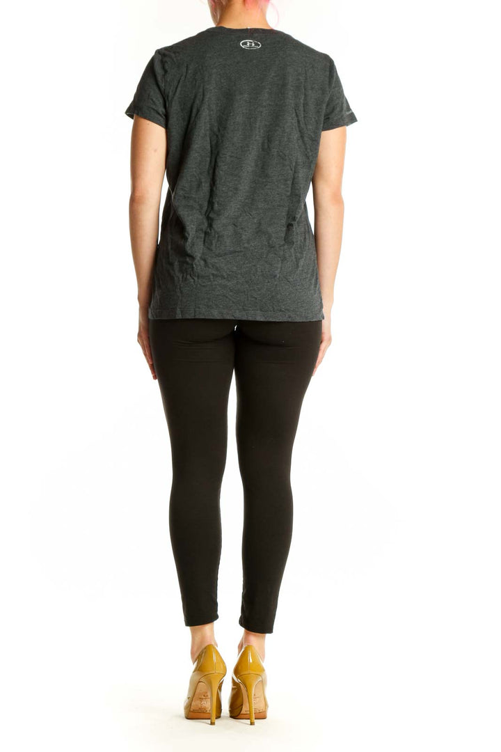 Charcoal gray Under Armour women's t-shirt with white logo graphic on back, side view