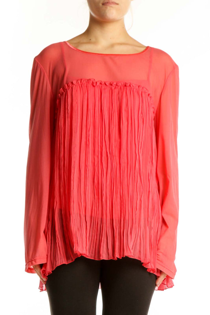 Red pleated long sleeve top with A-line silhouette and flowing pleated front detail