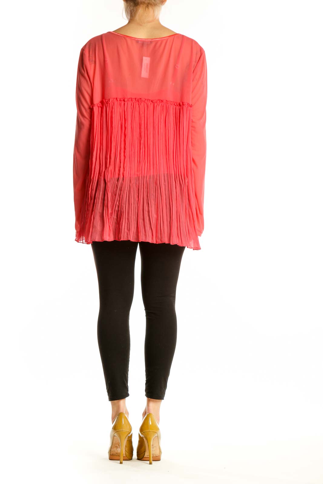 Back view of red pleated long sleeve top showing pleated detailing and relaxed fit
