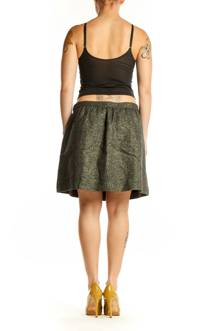 Olive green pleated A-line skirt, back view showing elegant drape and fit