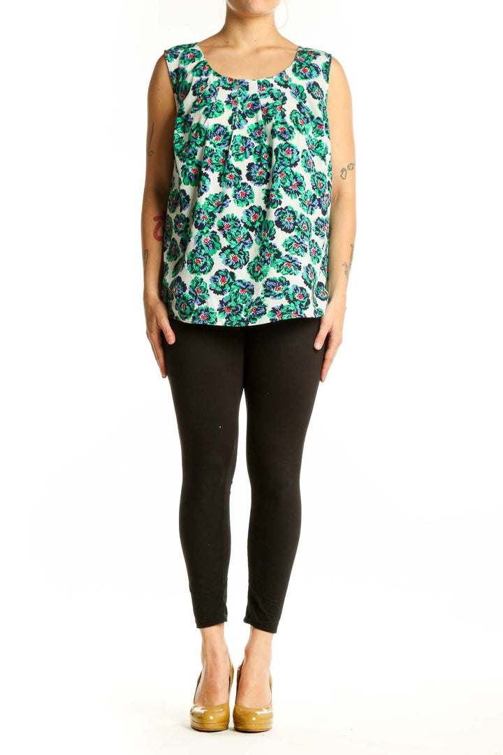 Cream sleeveless tank top with green and multicolor floral print, front view