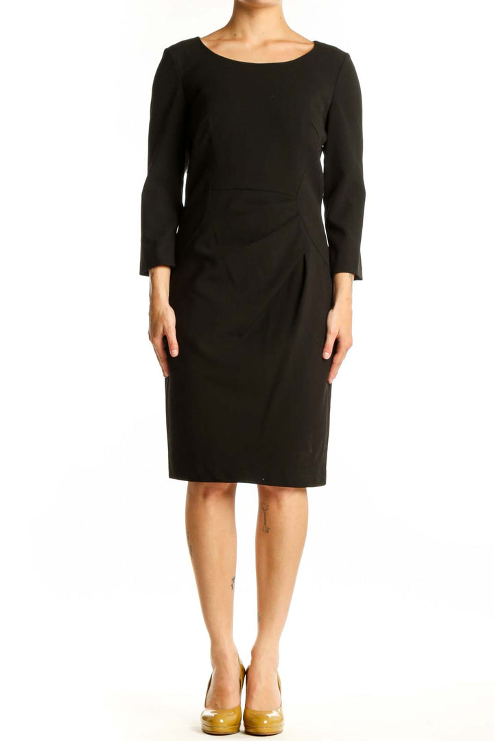 Calvin Klein black ruched midi dress with three-quarter sleeves, front view on model
