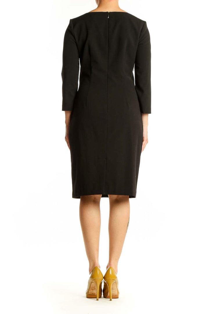 Calvin Klein black ruched midi dress with side ruching detail, back view on model