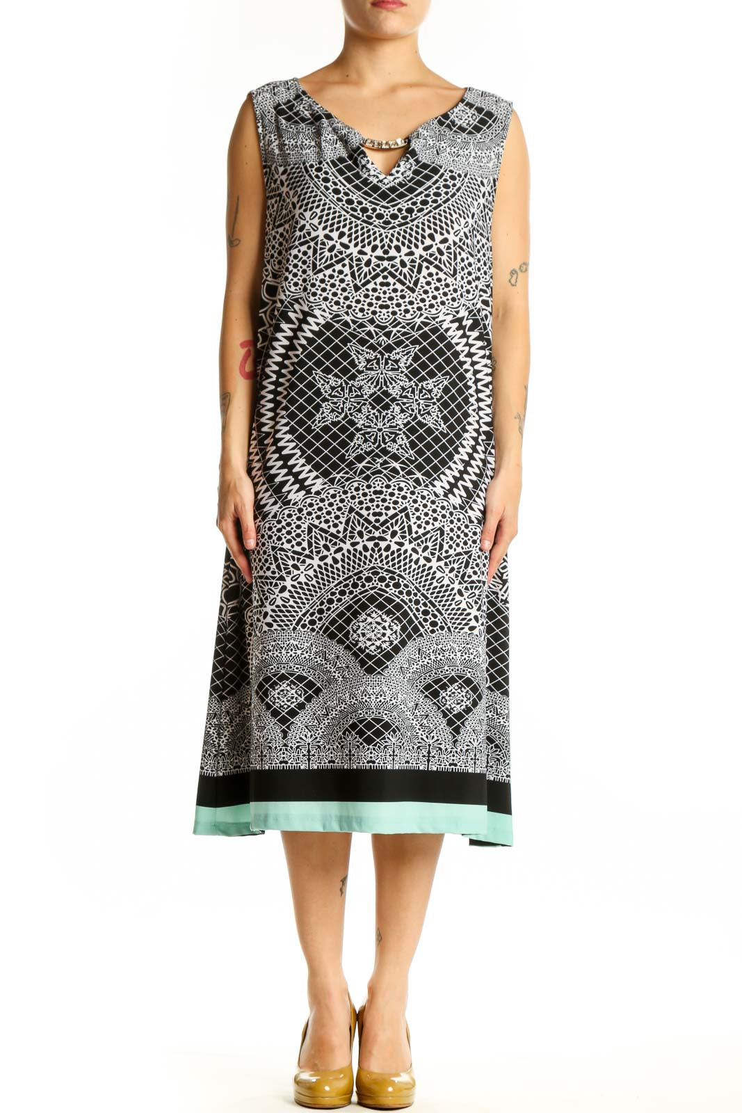Black and white geometric print sleeveless midi dress with V-neckline and mint green hem, front view