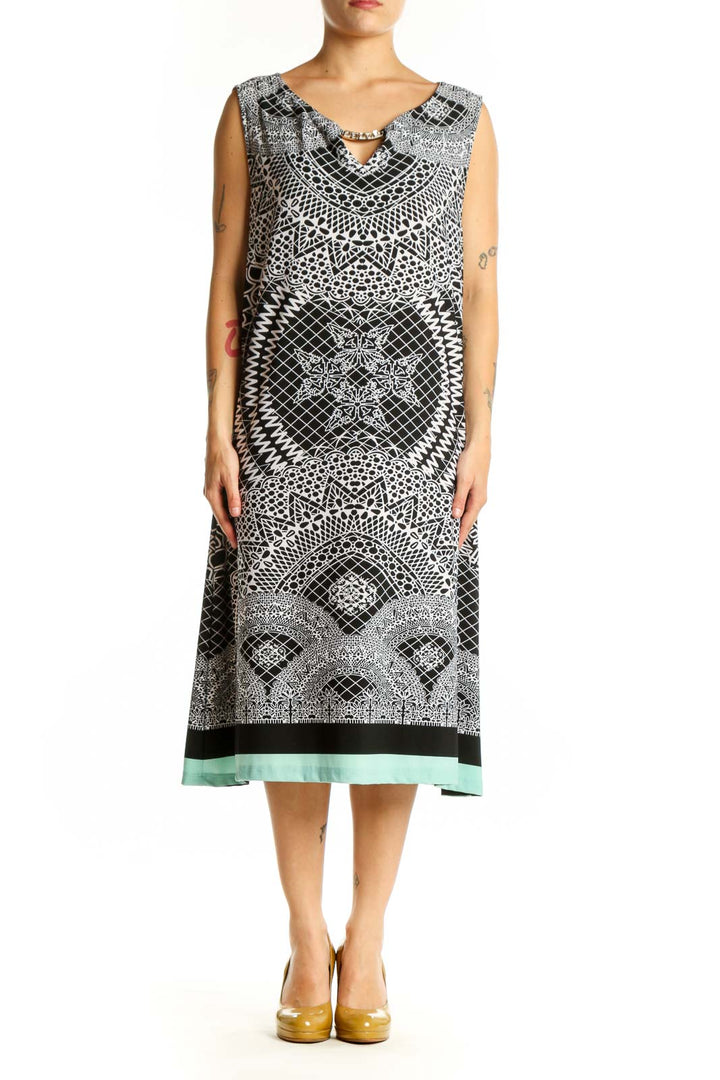 Black and white geometric print sleeveless midi dress with V-neckline and mint green hem, front view
