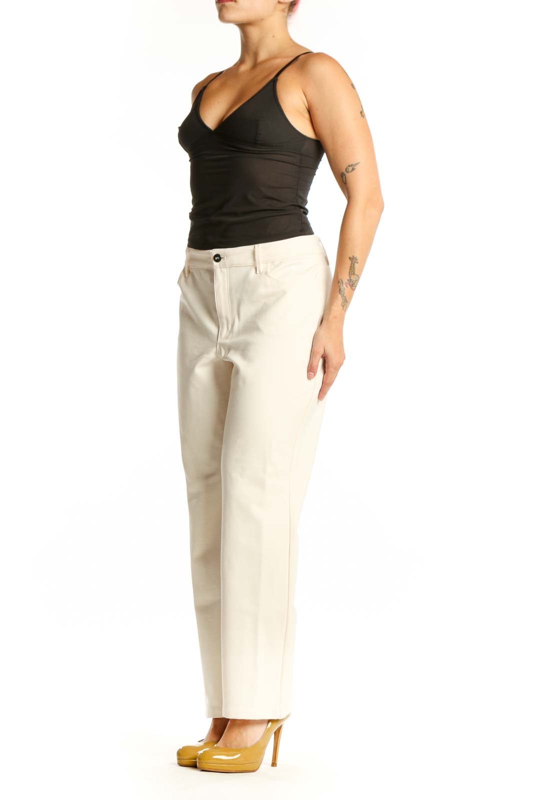 Front view of cream dress pants with straight-leg silhouette and high-waisted fit