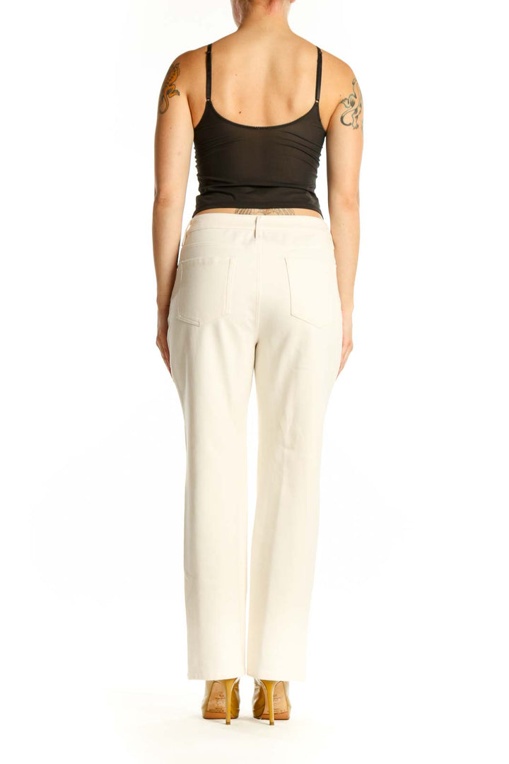 Back view of cream dress pants showing classic tailoring and comfortable stretch fit