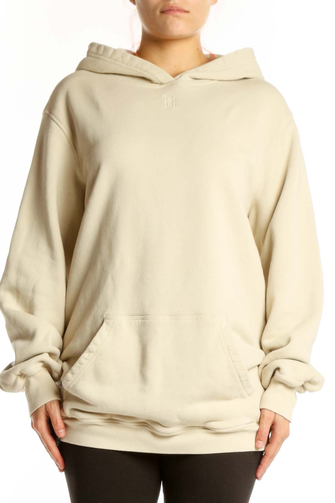 Woman wearing cream organic cotton hoodie with front pockets and relaxed fit by MB by Malene Birger