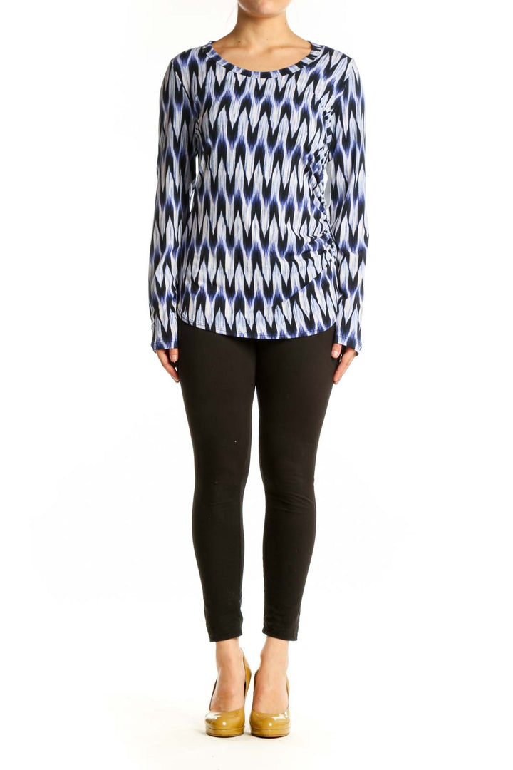 Karen Kane navy ikat print long-sleeve top with wrap-front detail, front view on model