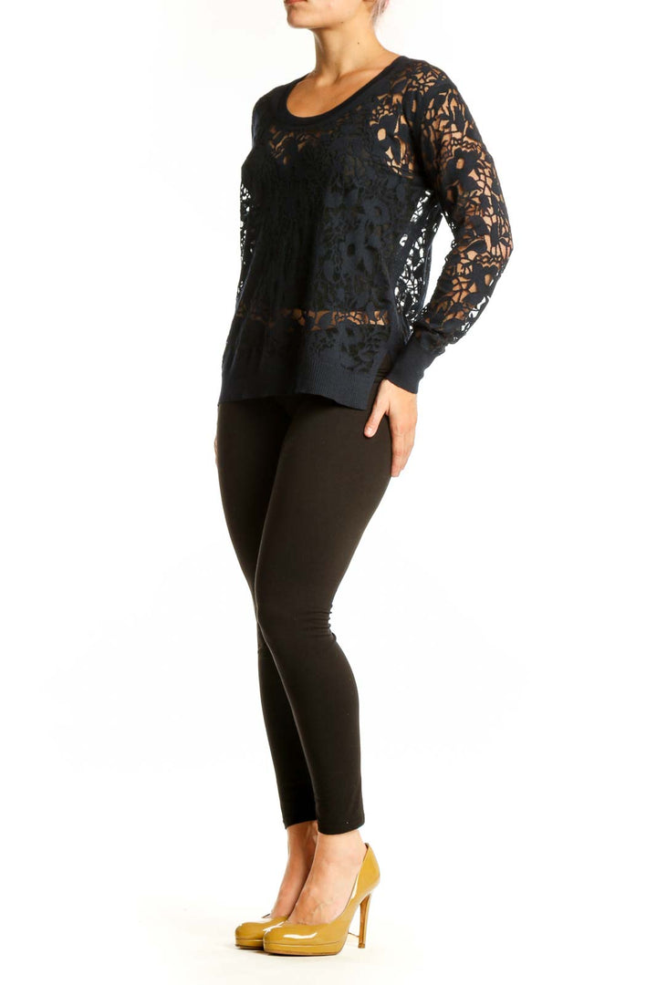 Black lace cashmere knit sweater with intricate lace detailing on sleeves and body, crew neckline, front view
