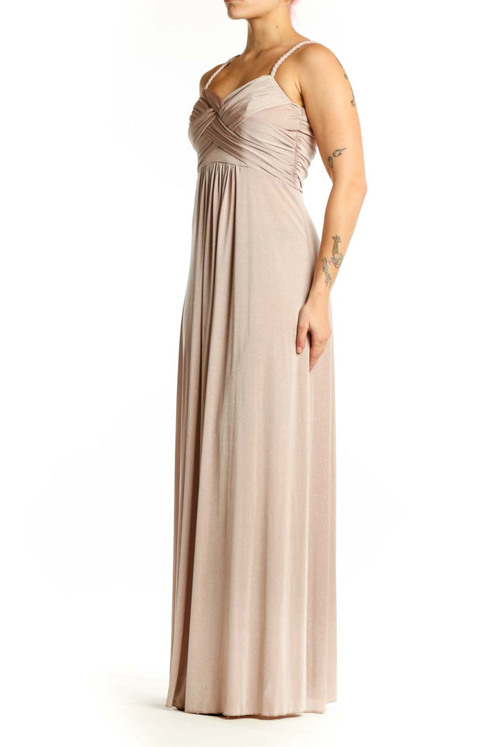 Beige pleated sweetheart neckline maxi dress with spaghetti straps and flowing skirt, front view