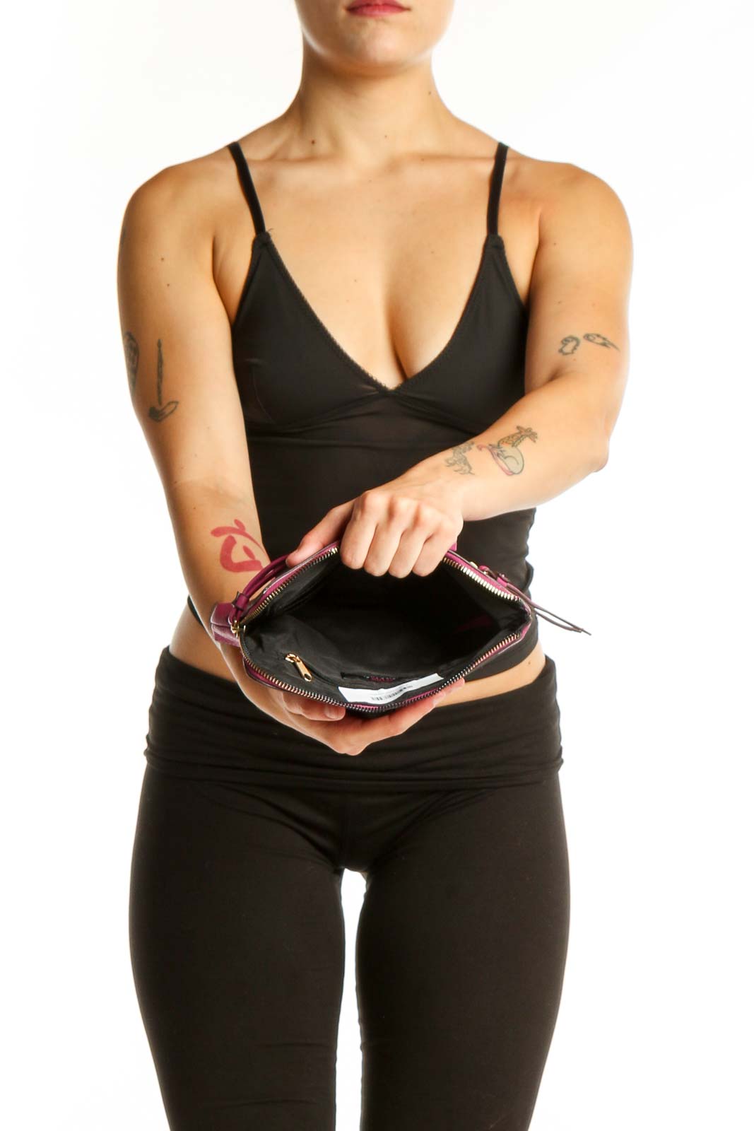 Pink PVC clutch styled as wearable wristlet accessory with zipper pocket detail