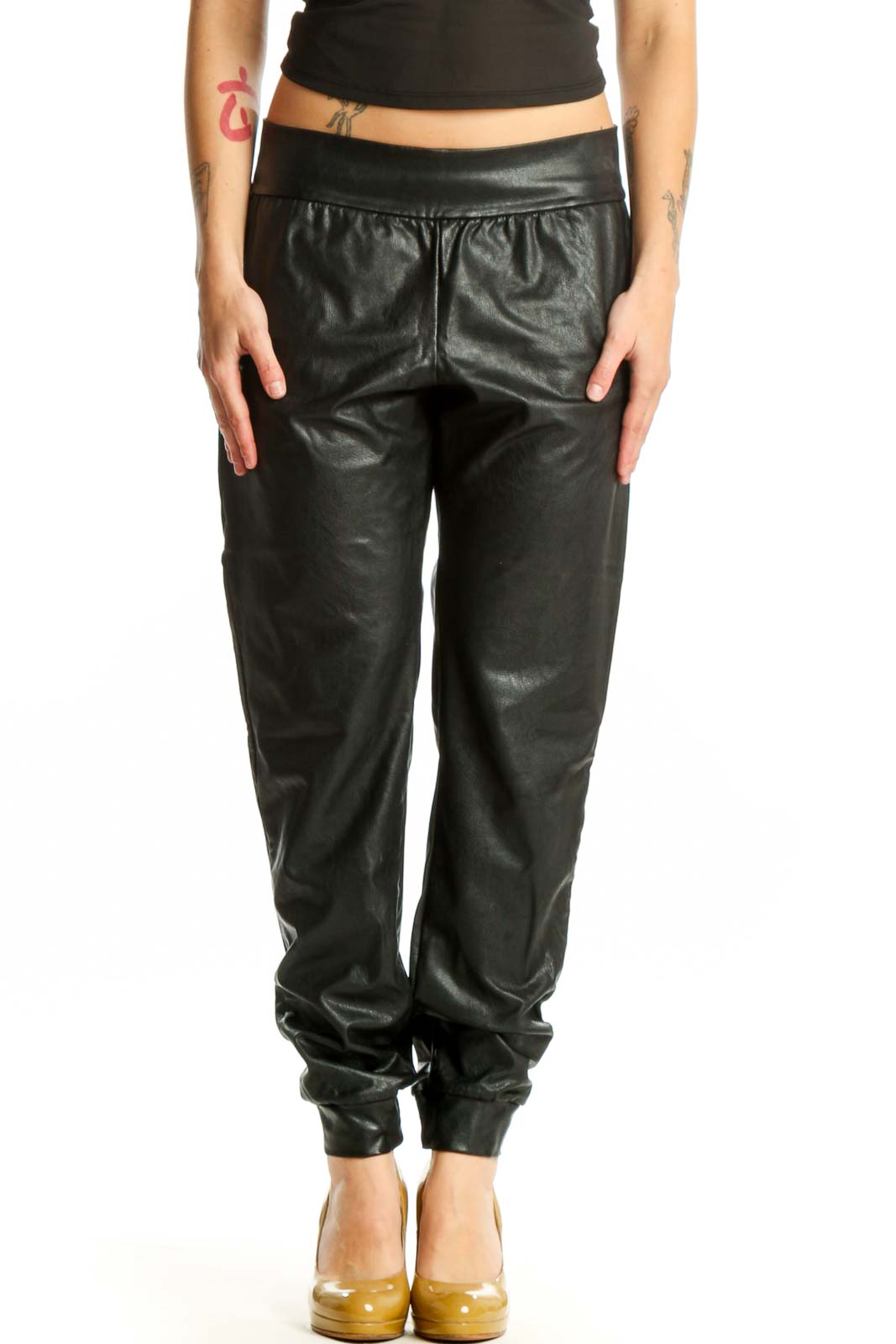 Black leather jogger pants with drawstring waist and tapered ankles, front view