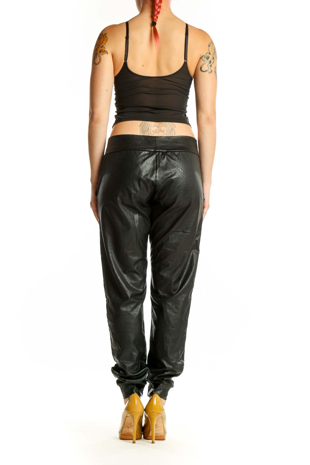 Black leather jogger pants with functional pockets, back view on model