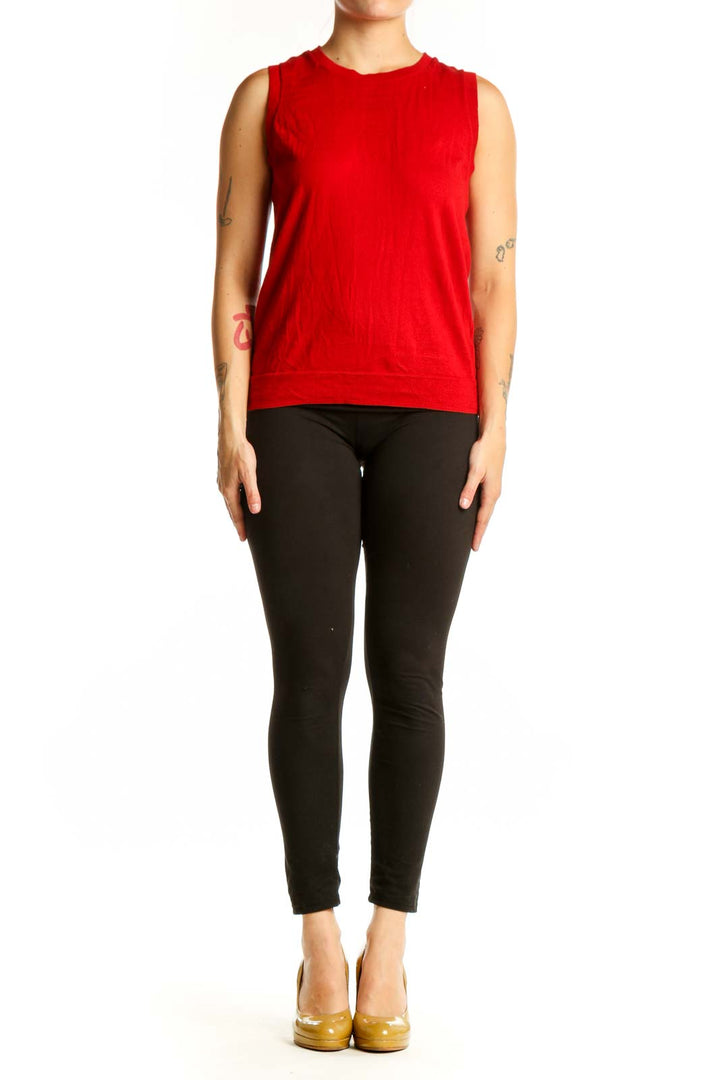 Red cotton sleeveless tank top with crew neckline, front view on model