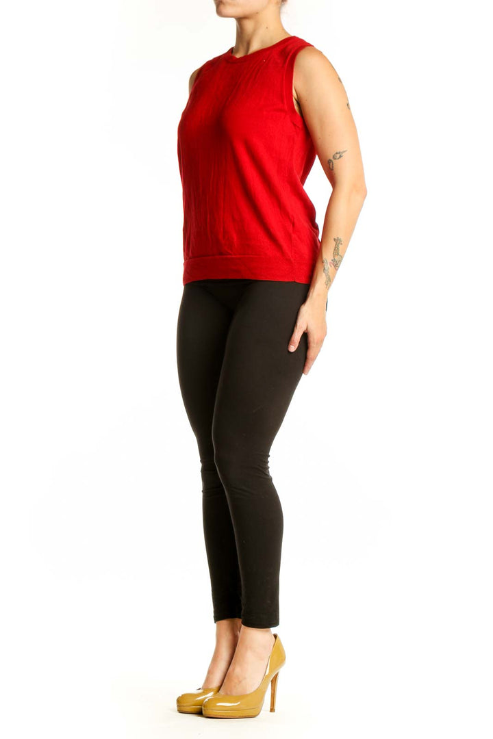 Red cotton sleeveless tank top with crew neckline, front view on model