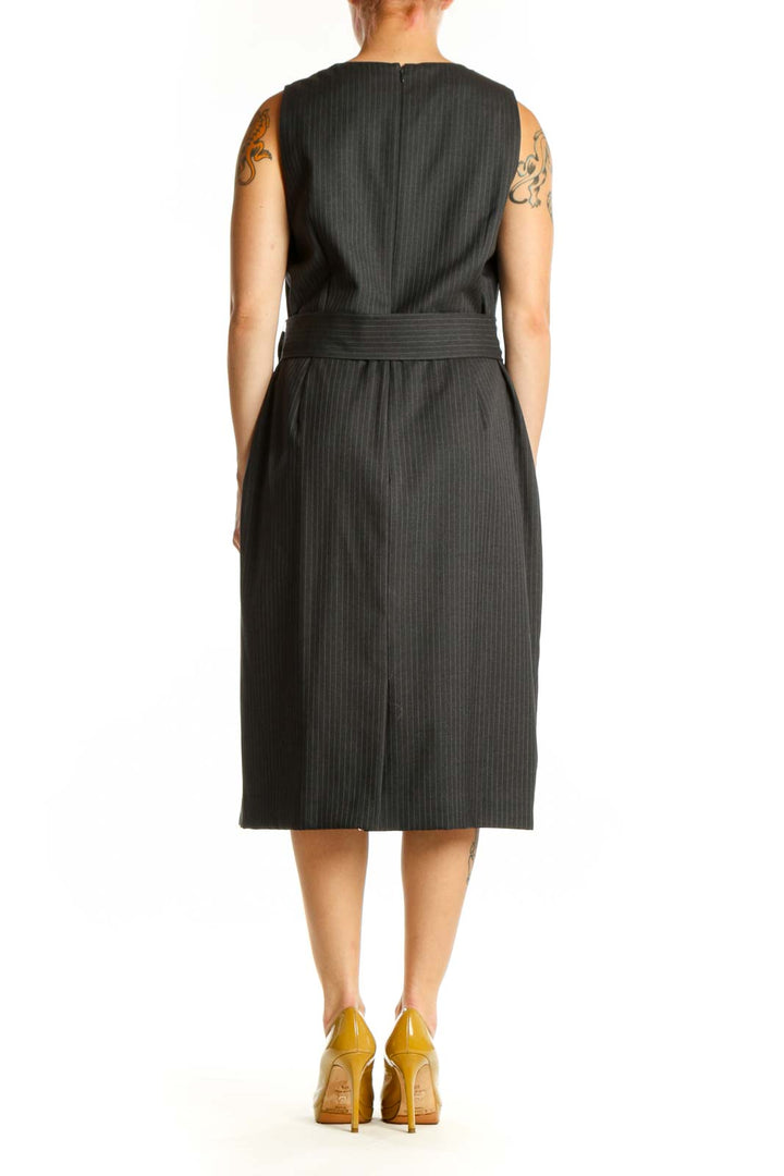 Black pinstriped wool midi dress with belted waist, back view