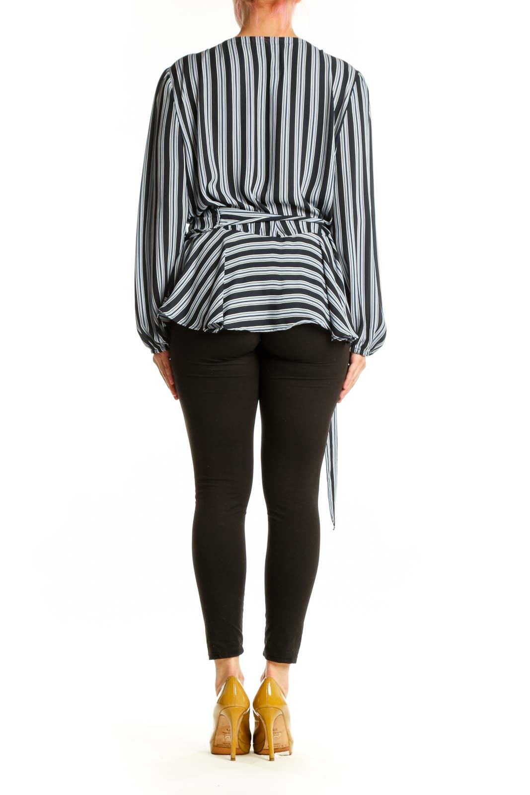 Navy and white striped wrap blouse with side tie detail, back view on model