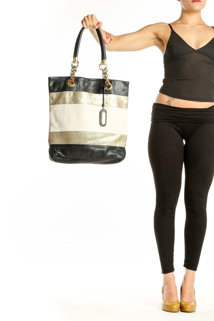 Black and gold striped genuine leather tote bag by Cynthia Rowley with dual handles and chain accents