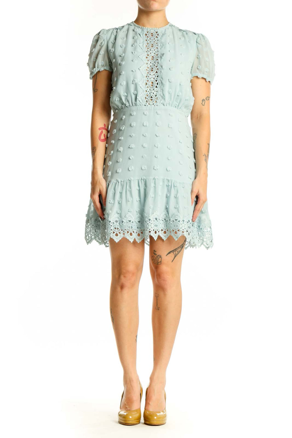 Cream textured lace mini dress with puffed sleeves and lace trim front view