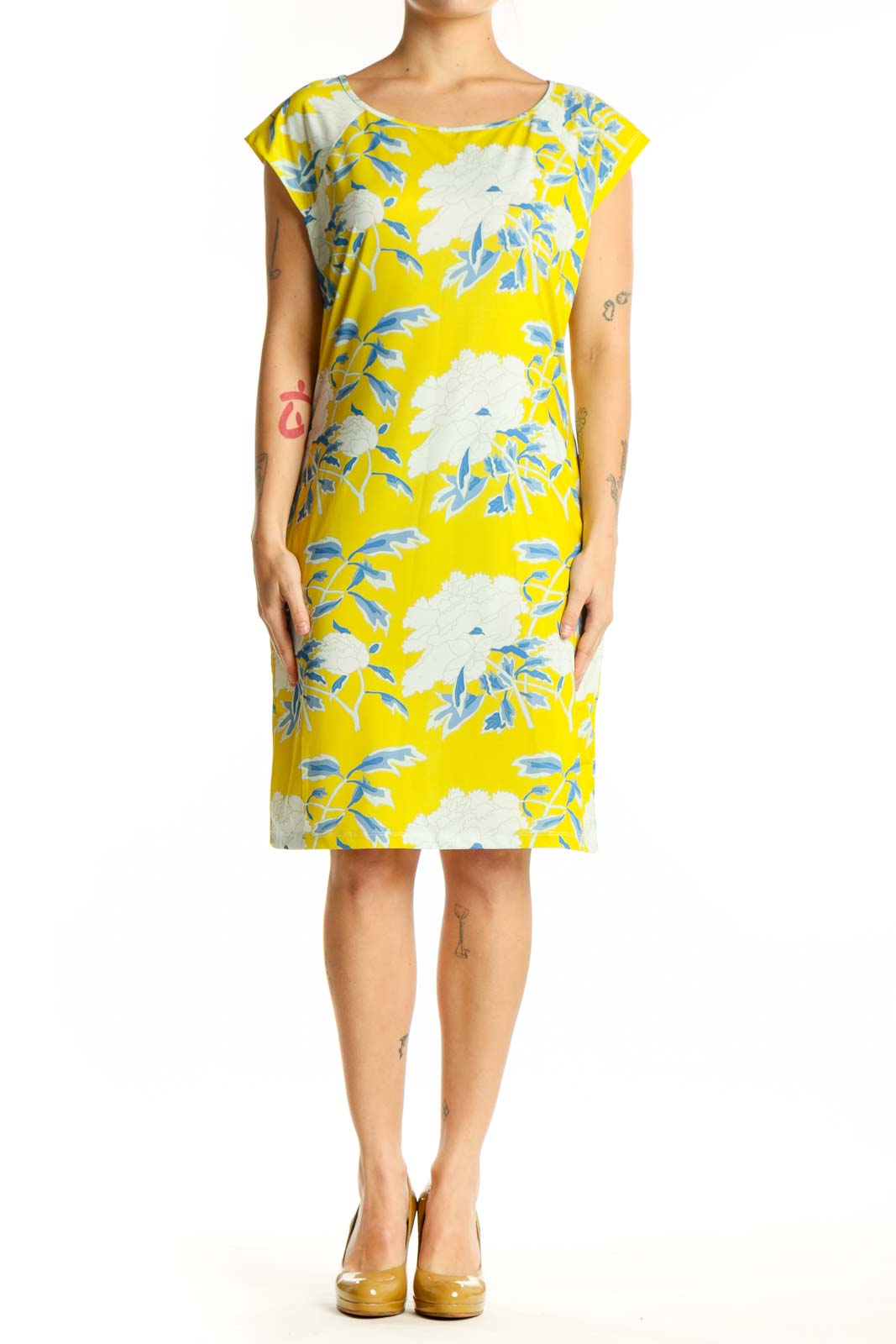 Front view of yellow floral print shift dress with blue and white botanical pattern, short sleeves, and crew neckline