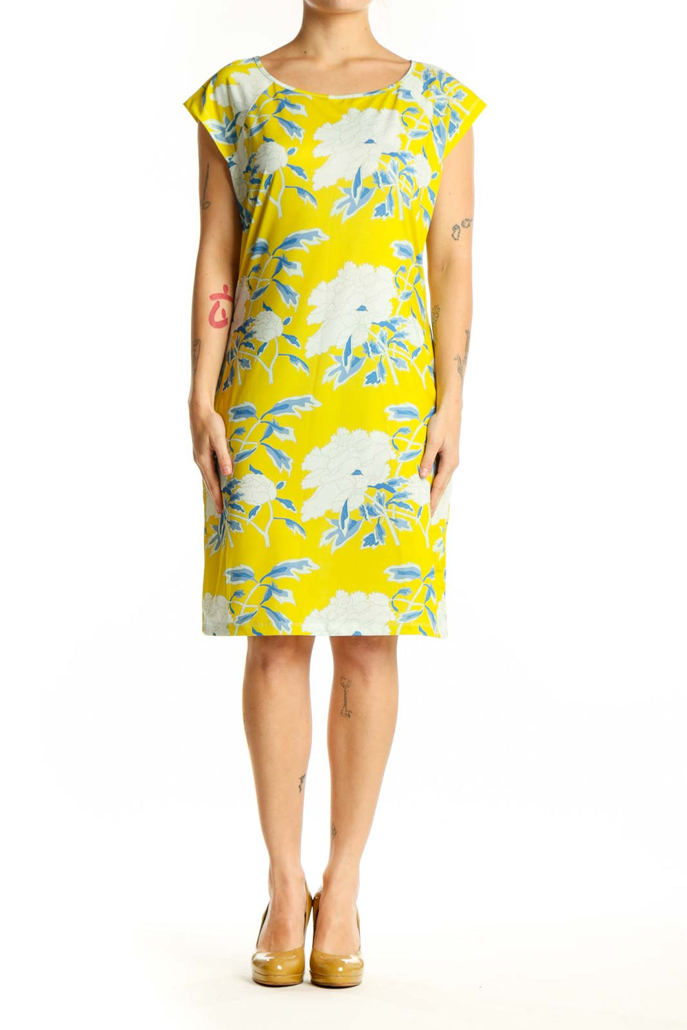 Front view of yellow floral print shift dress with blue and white botanical pattern, short sleeves, and crew neckline