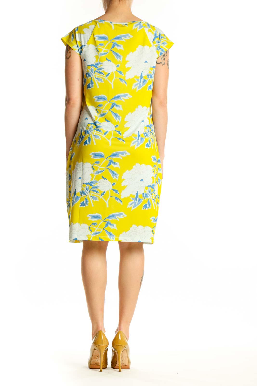 Back view of yellow floral print shift dress showing the full botanical pattern and relaxed shift silhouette