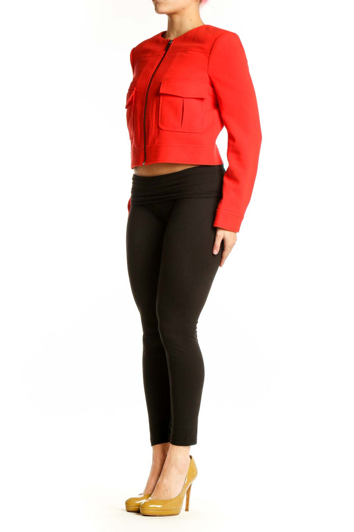 Red cropped utility jacket with cargo pockets and full-length zipper, front view
