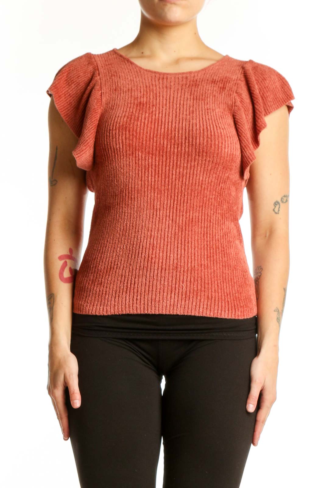 Rust orange ribbed top with ruffle cap sleeves and crew neckline, front view on model